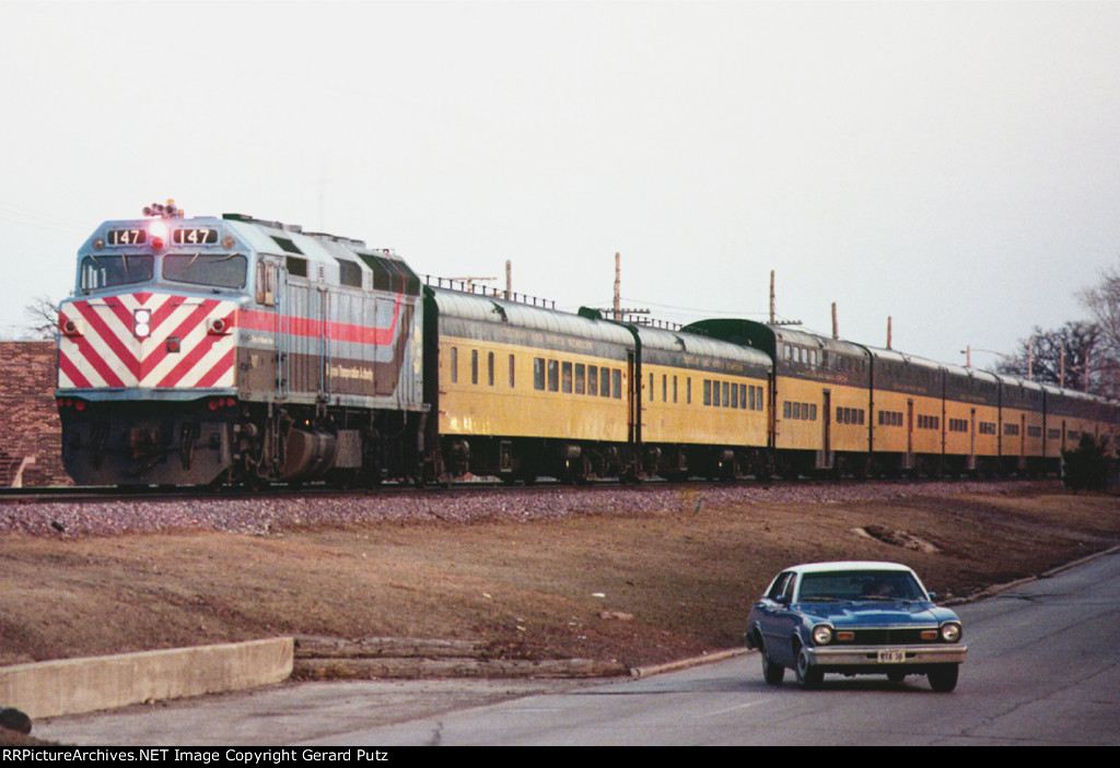 w/b Commuter Train led by RTA F40PH #147, Village of Hanover Park